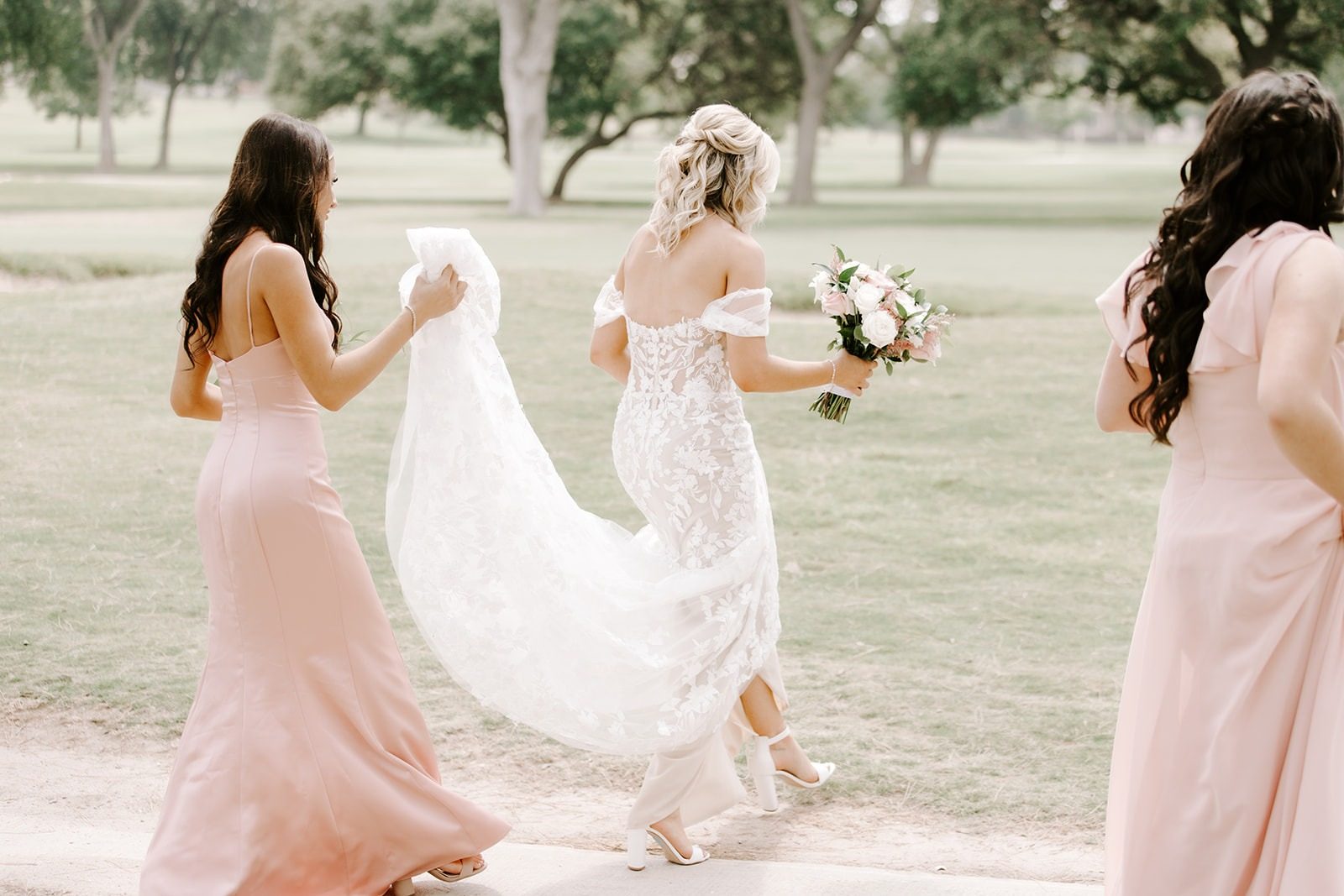 The bride and her bridesmaids walking together